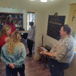 (standing) Heidi Adams, Kennadi Hebel, Coleman Cummins, and Aiden Colbert listen as Dr. Will Shannon explains the Messigner survey equipment.