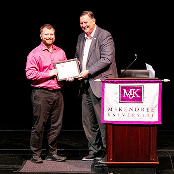 Calvin Wertman Receiving Award from President Dobbins