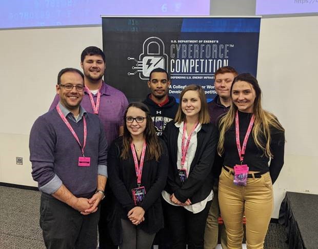 George Kriss, director of information technology and team adviser; Alyssa Koston, captain; Chloe Gamber, Emily Williams; back row, Kyle Hostetter, Alijah Thomas and Jakob Eddleman.