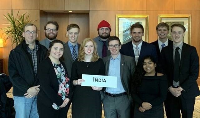 Representing the delegation from India at the American Midwest Model UN conference were, front row: Rebecca Postula, Katherine Gemmingen, Caden Owens, Haylee Christ; back row: Dr. Brian Frederking, Cameron Nollman, Kyle Nordmann, Justin Fausz, Logan Spaeth, Scott Anderson and Cole Nordmann.