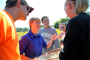 Faculty Member in the Field Working with Students