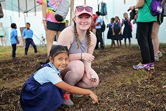 Rachael Fulton '19 Ppants Seeds for Classroom Garden with Belizean Student