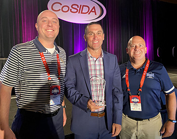 Former Sports Information Director Scott Cummings was awarded a CoSIDA Lifetime Achievement Award